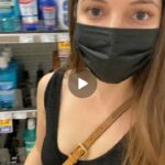 Flashing her shaved pussy at store