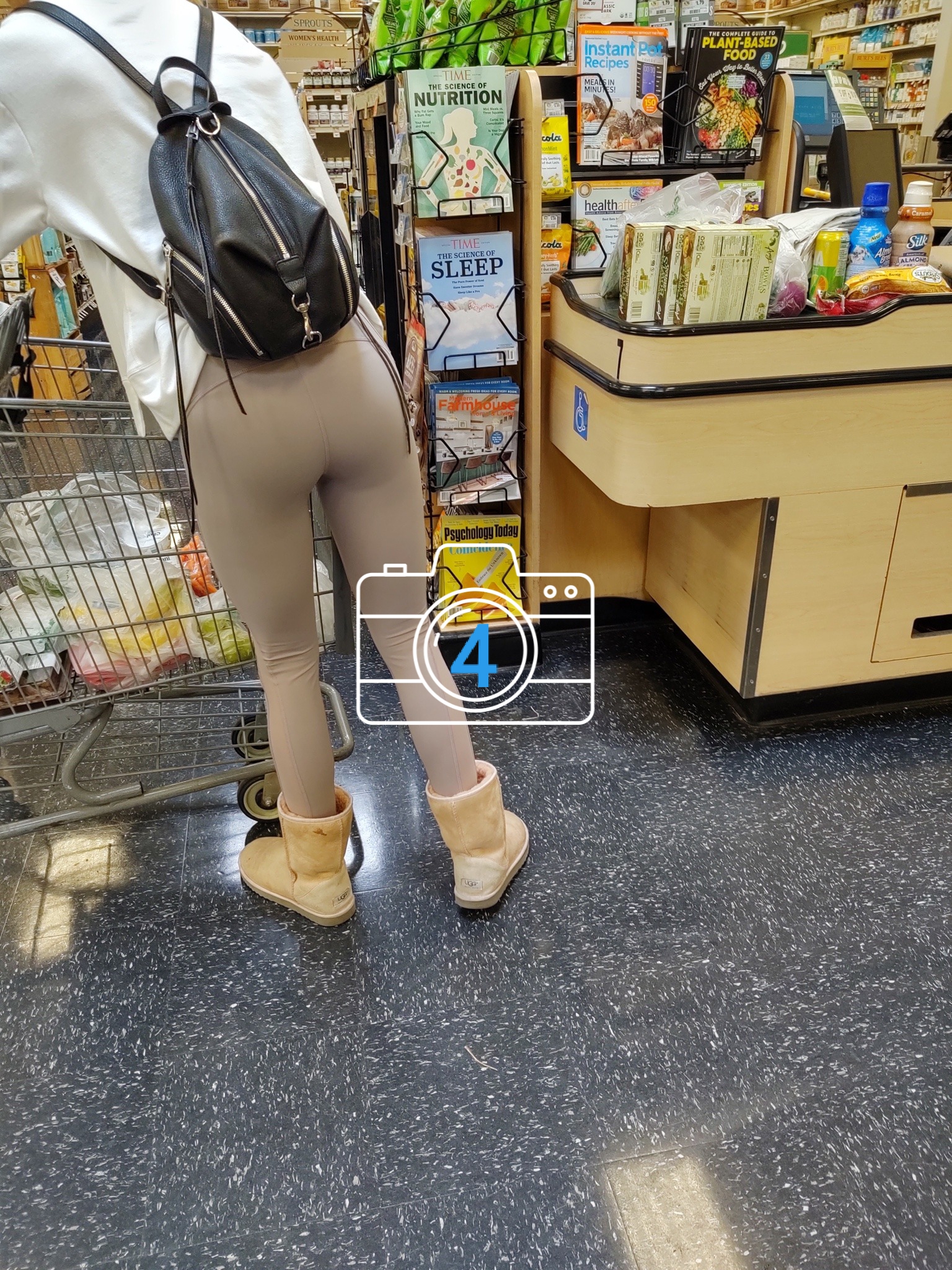 A lady's legs revealing from under a garment in a shop